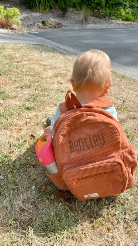 Social image of a happy Weary Theory customer with their new backpack.