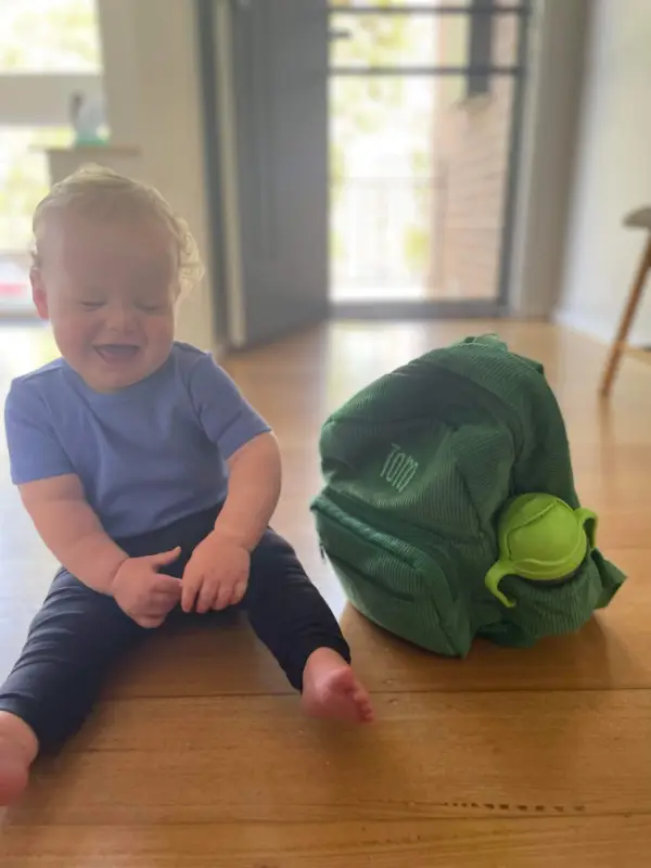 Social image of a happy Weary Theory customer with their new backpack.