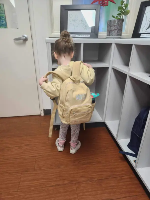 Social image of a happy Weary Theory customer with their new backpack.