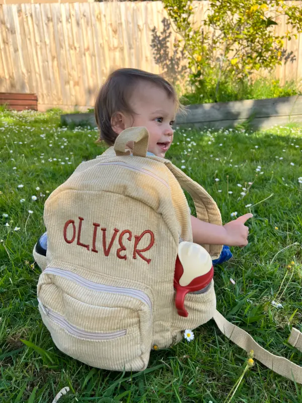 Social image of a happy Weary Theory customer with their new backpack.