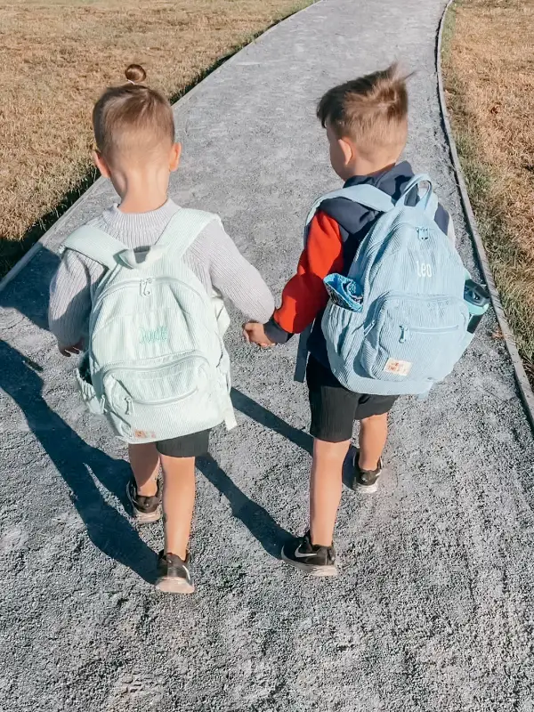 Social image of a happy Weary Theory customer with their new backpack.