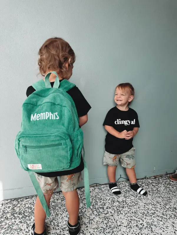 Social image of a happy Weary Theory customer with their new backpack.