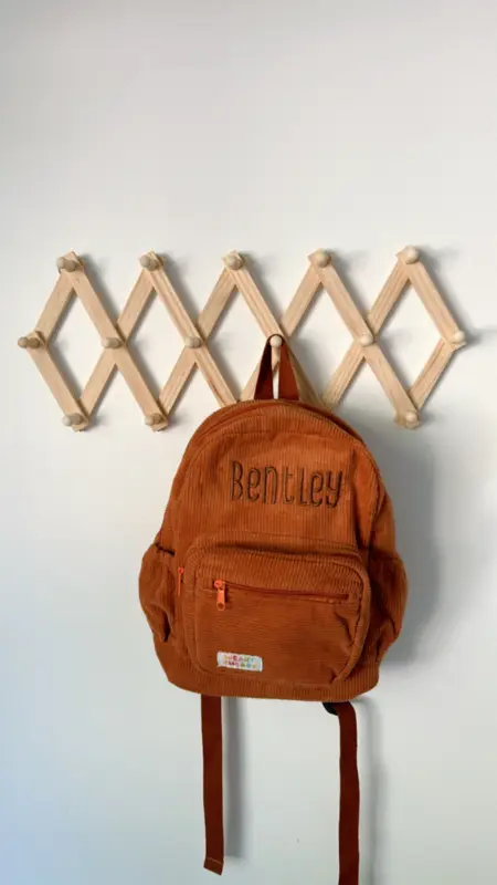 Social image of a happy Weary Theory customer with their new backpack.