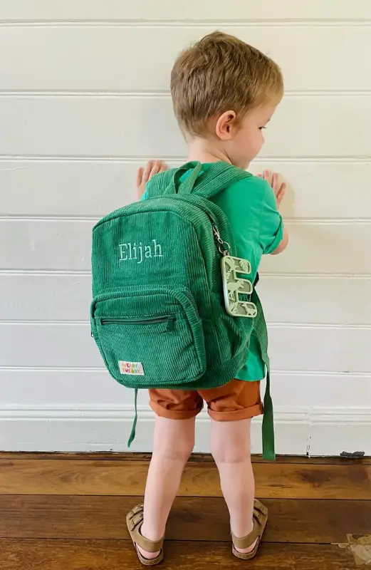 Social image of a happy Weary Theory customer with their new backpack.