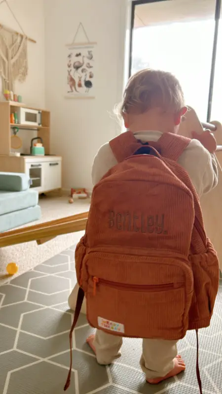 Social image of a happy Weary Theory customer with their new backpack.