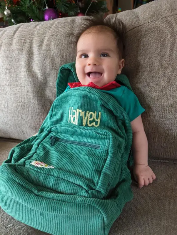 Social image of a happy Weary Theory customer with their new backpack.